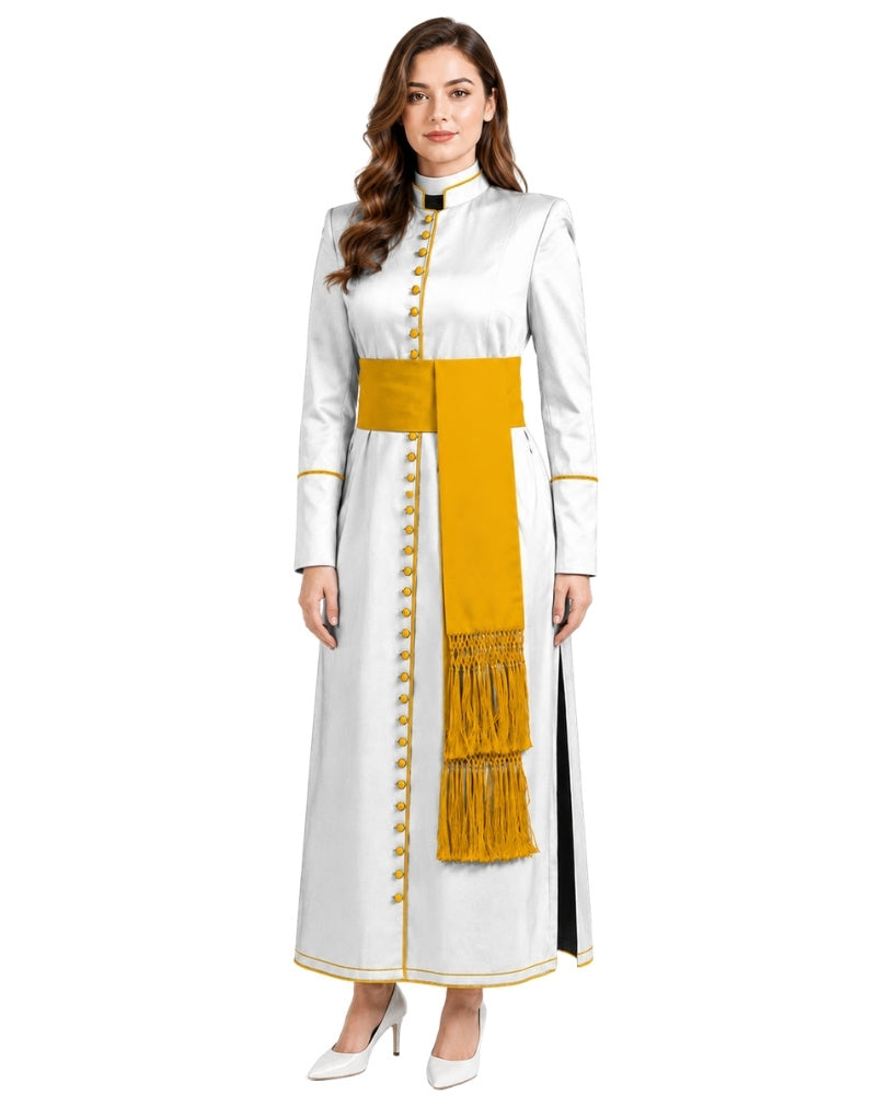 A woman modeling a long white cassock or robe with a wide mustard yellow sash, gold button details, and a black collar, set against a plain white background.