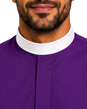 Close-up of a man wearing a purple clerical collar shirt with a contrasting white collar, shown against a plain white background.