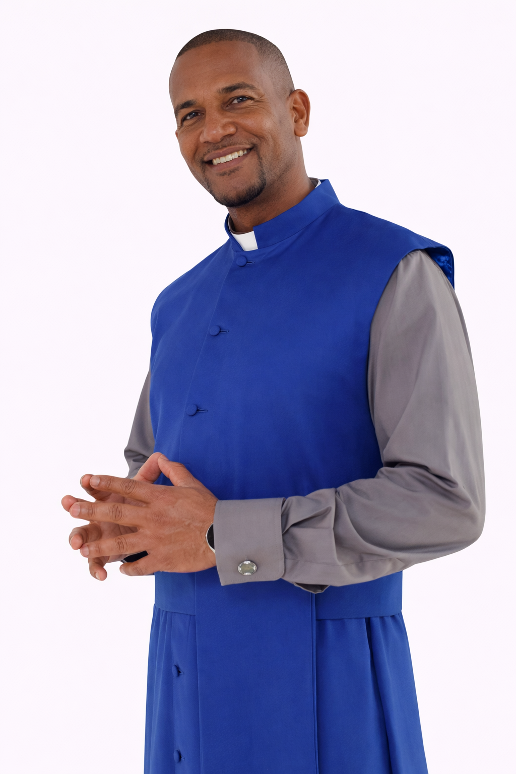 Man wearing a blue cassock with a gray shirt underneath on a white background