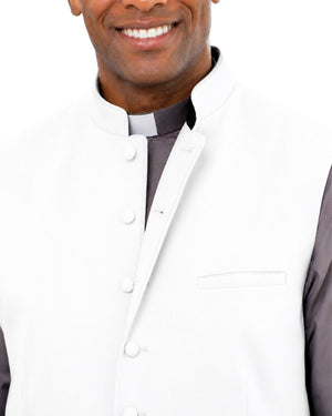 Man wearing a white vest over a gray long-sleeve shirt on a light white background.