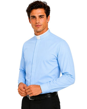 A man wearing a light blue long-sleeve clerical shirt with a white clerical collar, paired with black trousers and a black belt, against a plain white background.