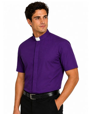 A man wearing a purple short-sleeve clerical shirt with a white collar tab, paired with black trousers and a black belt, against a plain white background.