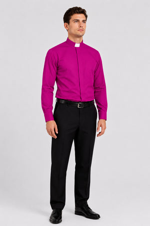 Man wearing a bright pink shirt and black pants on a white background