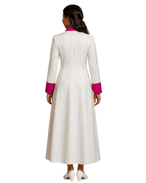 A woman shown from the back wearing a long white cassock with bright pink contrast trim at the collar and cuffs, photographed against a plain white background.