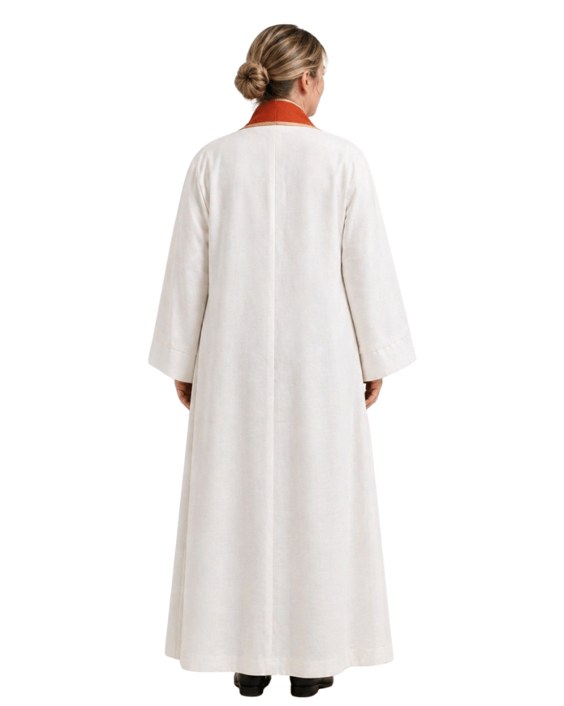 A woman viewed from the back wearing a long white robe with a contrasting red collar, set against a plain white background.
