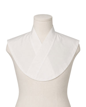 A white Amice displayed on a cream mannequin torso against a plain white background.