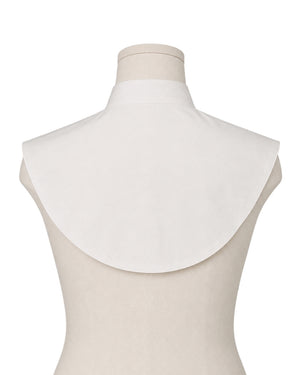 A white Amice displayed on a beige mannequin torso against a white background.