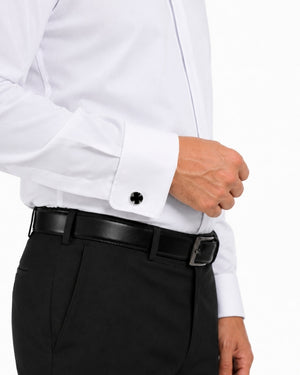 Man wearing a white clerical shirt and black pants on a white background