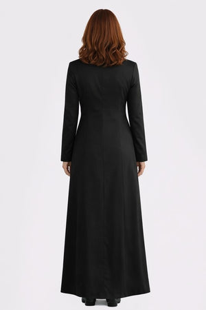 Woman wearing a black long dress on a white background