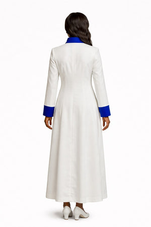 Woman wearing a long white robe with blue accents on a white background