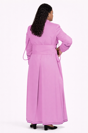 Woman wearing a pink robe with a white background