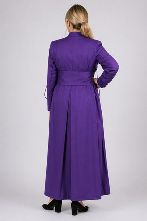 Purple coat worn by a person on a white background