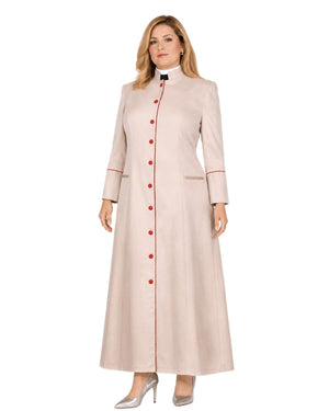 A woman modeling a long, light beige or cream-colored cassock with a high stand collar, red button front, and red piping details on the cuffs and front opening, paired with silver heels against a plain white background.
