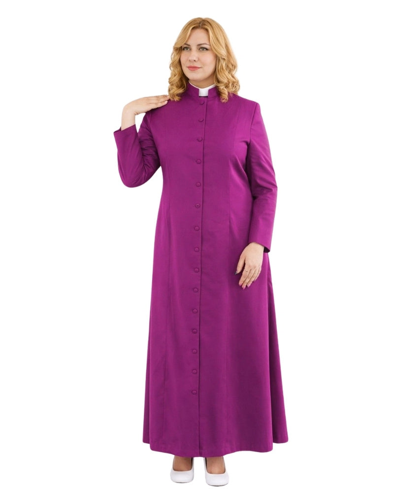 A woman modeling a long magenta-purple clerical robe with a high collar, front button closure, and a white clerical collar, set against a plain white background.