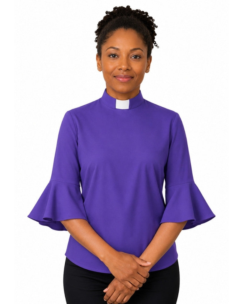 Woman wearing a purple clergy shirt with a white collar on a white background.
