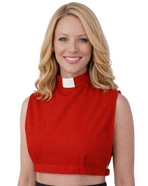 A smiling woman wearing a red sleeveless mock-neck top with a white clerical collar, shown against a plain white background.