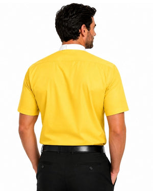 A man wearing a bright yellow short-sleeve clerical shirt with a white collar, paired with black trousers and a black belt, shown in profile against a white background.