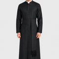 Man wearing a black priest's robe on a white background