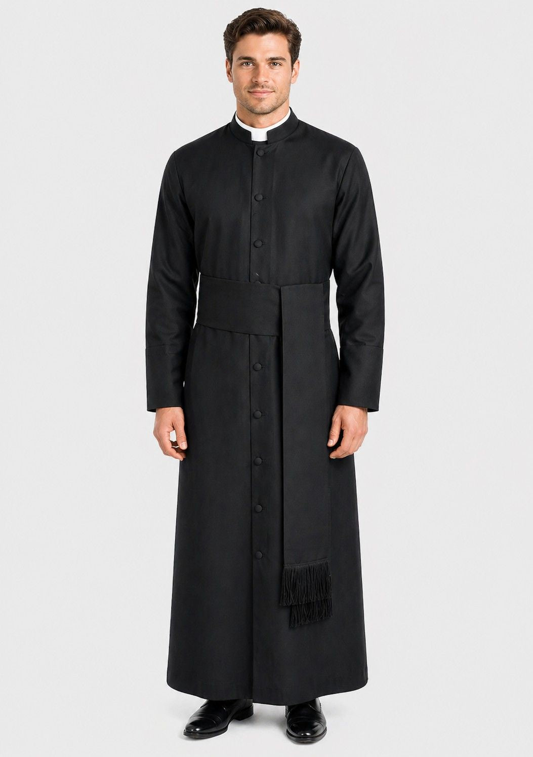 Man wearing a black priest's robe on a white background
