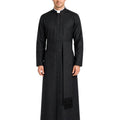 A man modeling a long black priestly robe with a collar, front buttons, a waist belt, and a black fringed drape, shown against a plain white background.