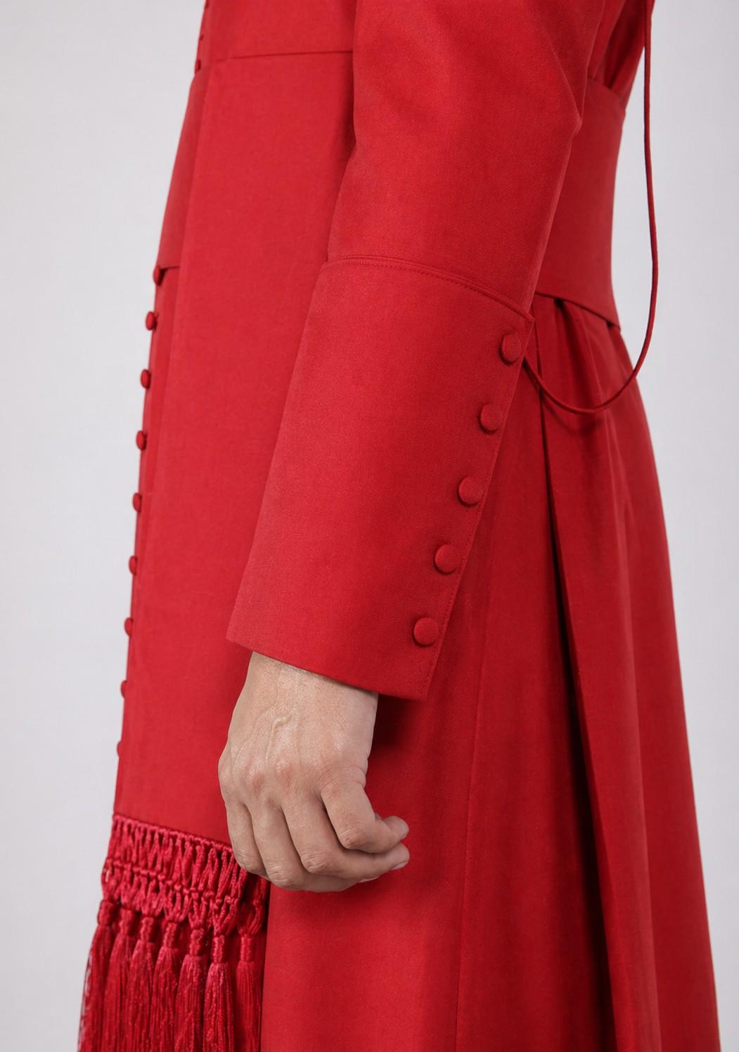 Red cassock with fringes on a white background