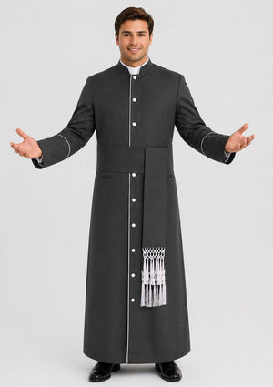 Man wearing a black cassock with white trim on a plain background