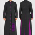 Long black robe with purple accents worn by a model on a white background