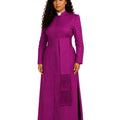 A woman modeling a long magenta-purple clerical cassock with a white collar, standing against a plain white background.