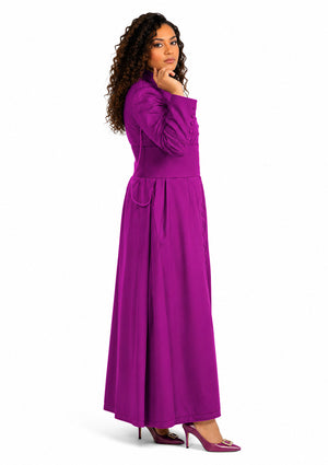 Woman wearing a long purple robe on a white background