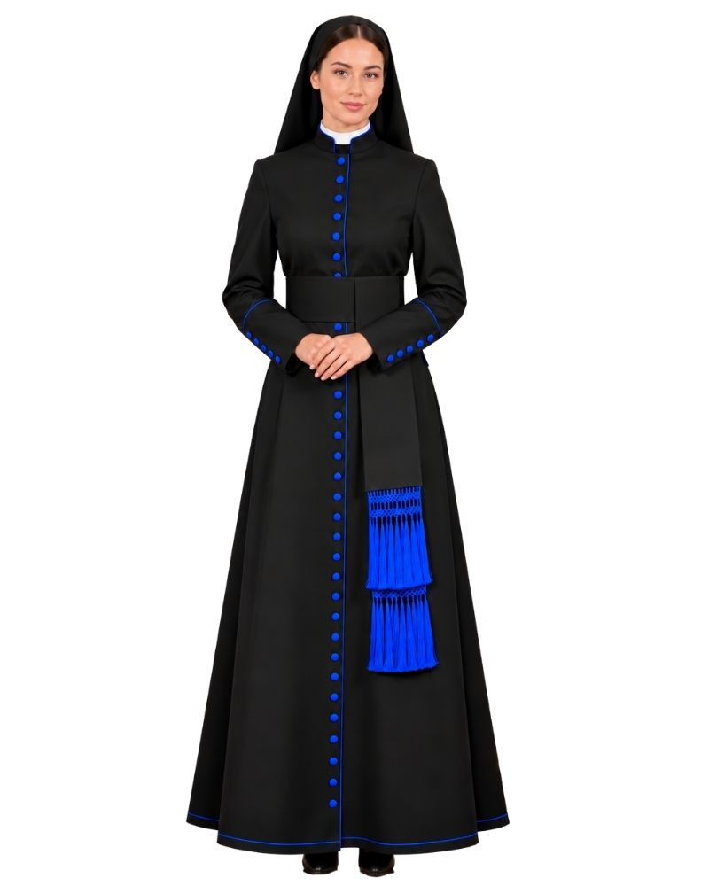 A woman modeling a Anglican Priest Cassock with bright blue trim, blue buttons, and a tiered blue sash detail, shown against a plain white background.