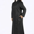 Woman wearing a long black robe on a white background
