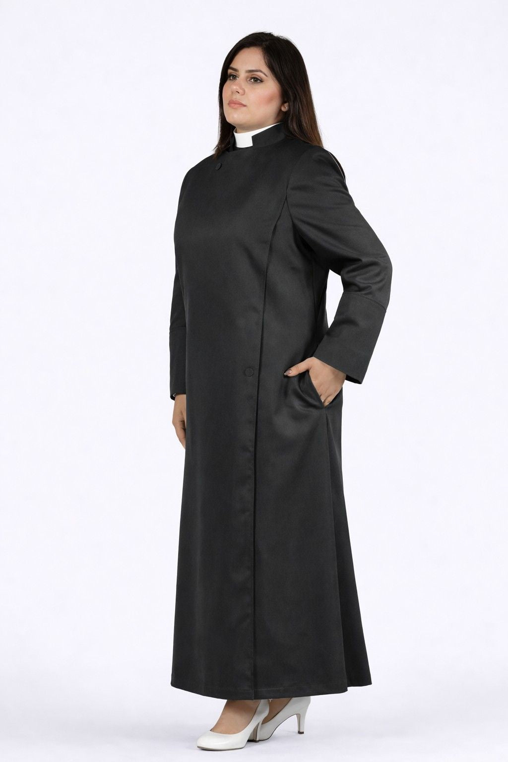 Woman wearing a long black robe on a white background