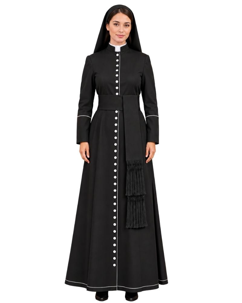 A woman modeling a Aurelia Black Cassock With White Trim, a white collar, and a vertical row of white buttons down the front, against a plain white background.