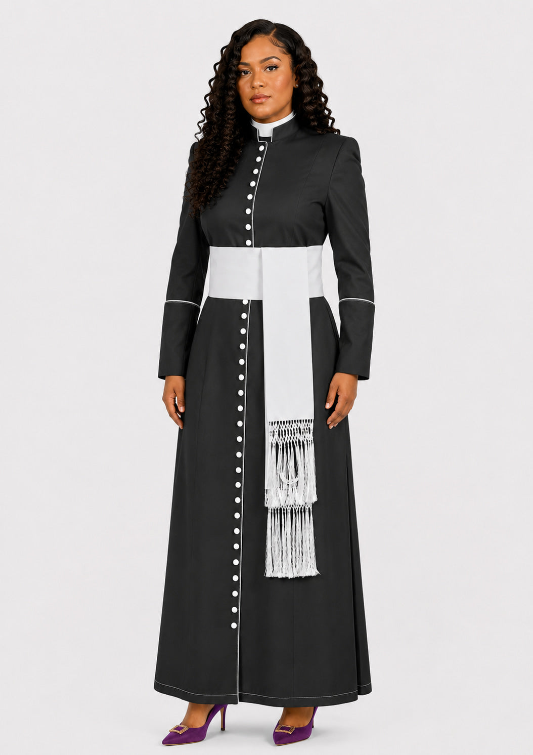 Woman wearing a black and white robe with a scarf on a white background