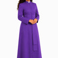 Woman wearing a purple robe on a white background 