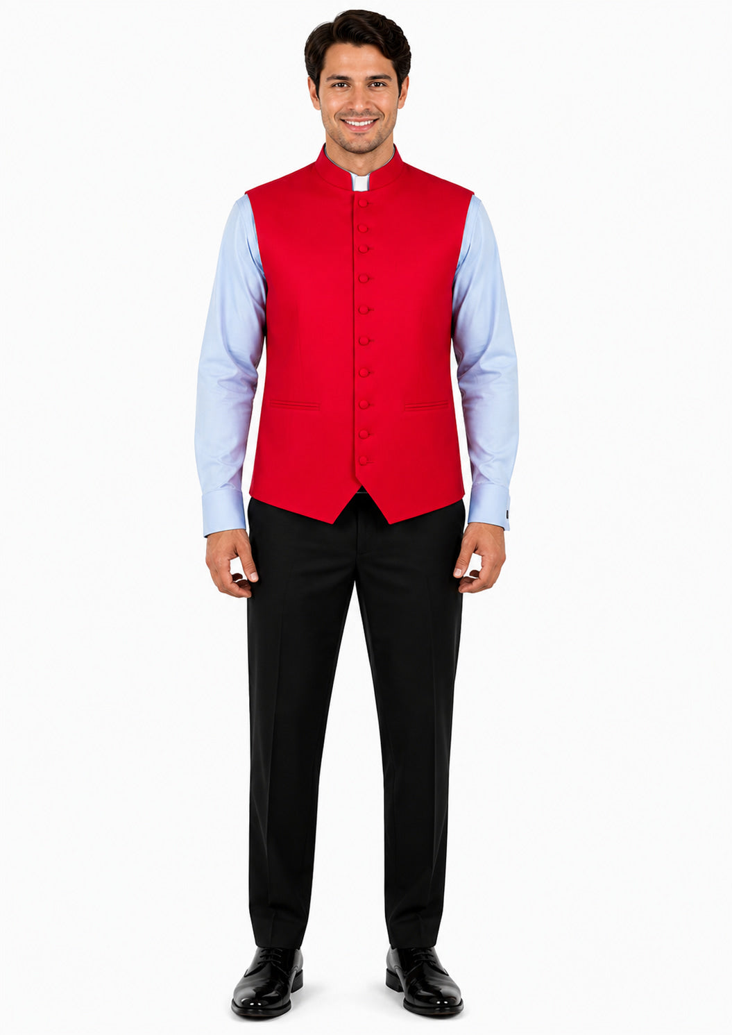Man wearing a red vest over a light blue shirt with black pants on a white background