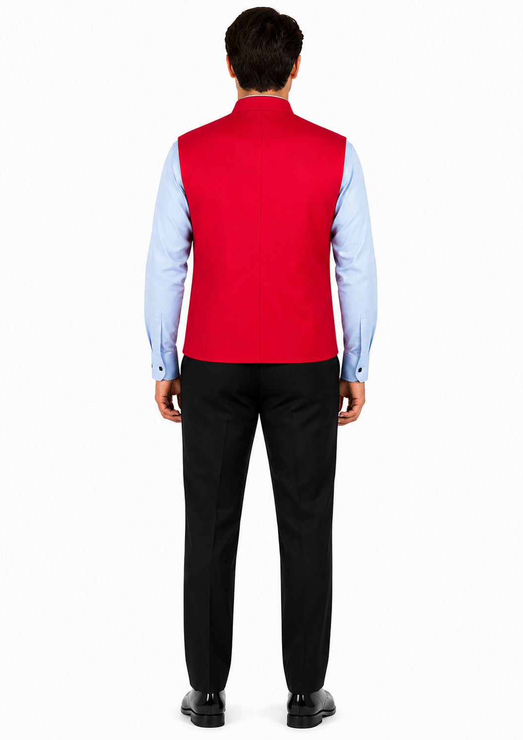 Man wearing a red vest over a light blue shirt with black pants on a white background