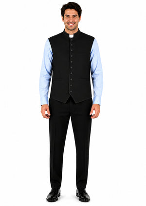 Man wearing a black vest over a light blue shirt on a white background