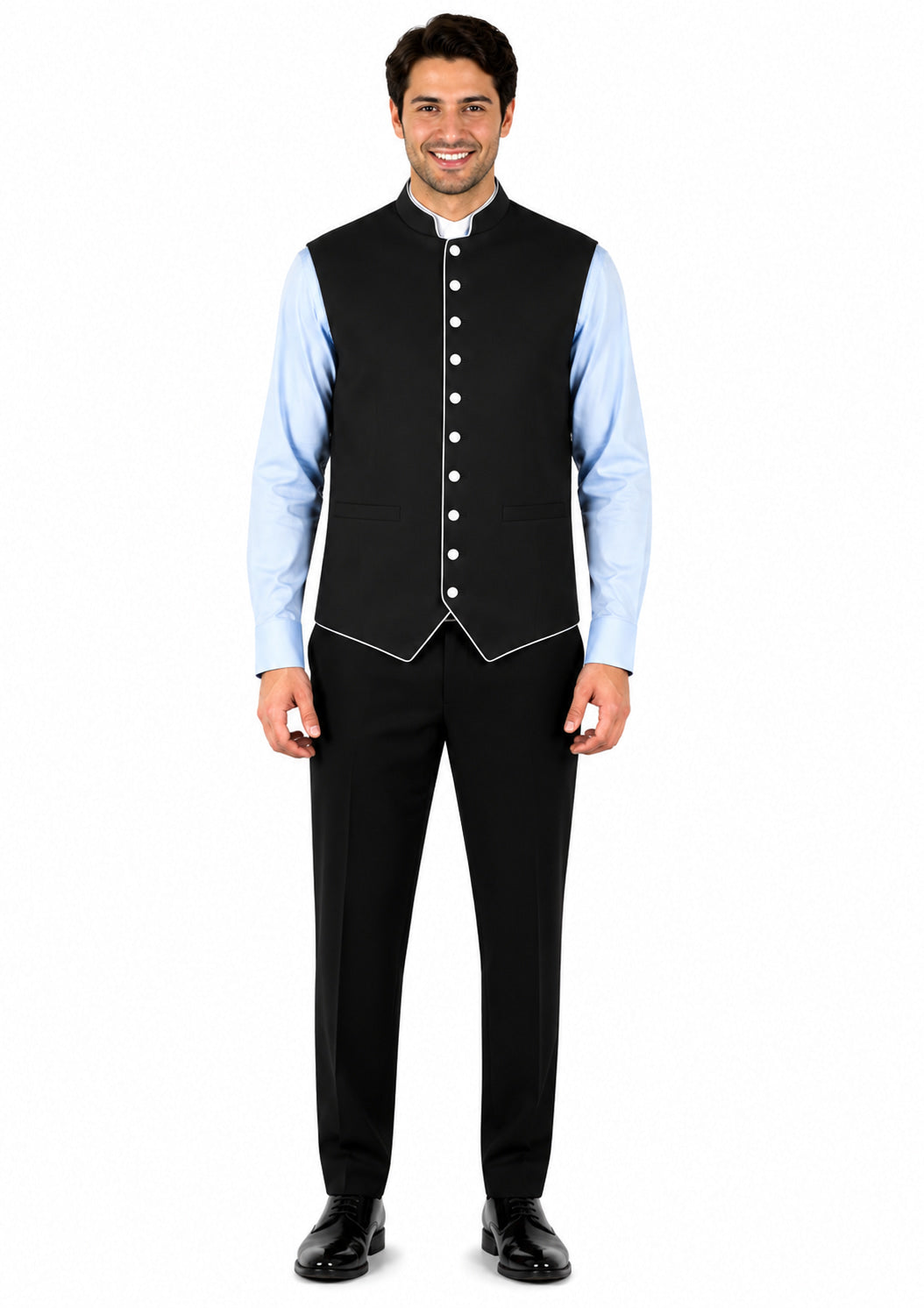 Man wearing a black vest over a light blue shirt on a white background