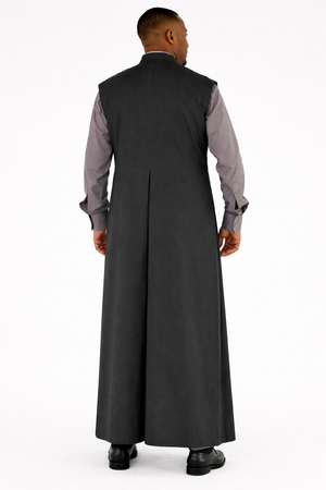 Man wearing a long dark gray robe over a light gray shirt on a white background