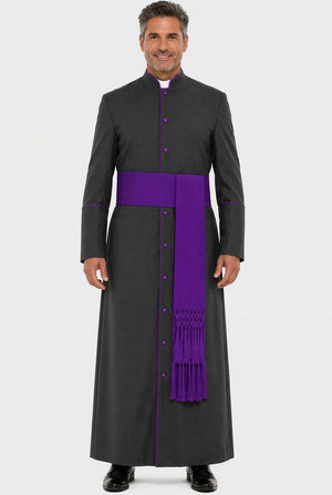 Man wearing a black robe with a purple sash on a white background