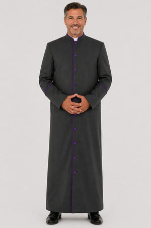 Man wearing a long dark gray robe with purple accents on a light gray background