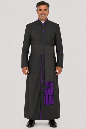 Man wearing a black robe with purple accents on a gray background