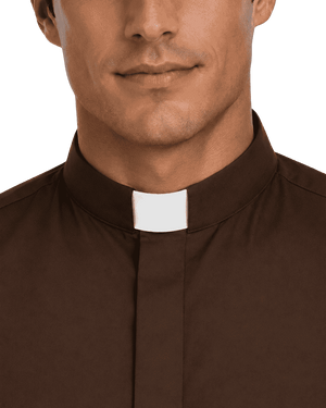 Close-up of a man wearing a brown clerical collar shirt with a white tab, shown against a plain white background.
