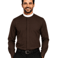 A smiling man wearing a dark brown long-sleeve clerical shirt with a white collar, paired with black trousers and a black belt, against a solid white background.