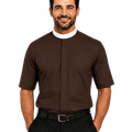 A smiling man wearing a brown short-sleeve clerical shirt with a white collar, paired with black trousers and a black belt, photographed against a solid white background.