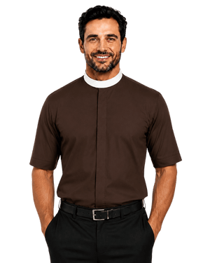 A smiling man wearing a brown short-sleeve clerical shirt with a white collar, paired with black trousers and a black belt, photographed against a solid white background.