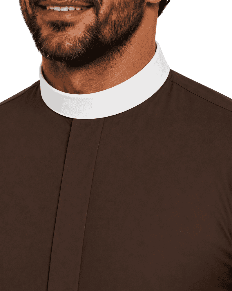 Close-up of a man wearing a brown clerical shirt with a contrasting white collar, cropped from the lower face to the chest against a plain light background.