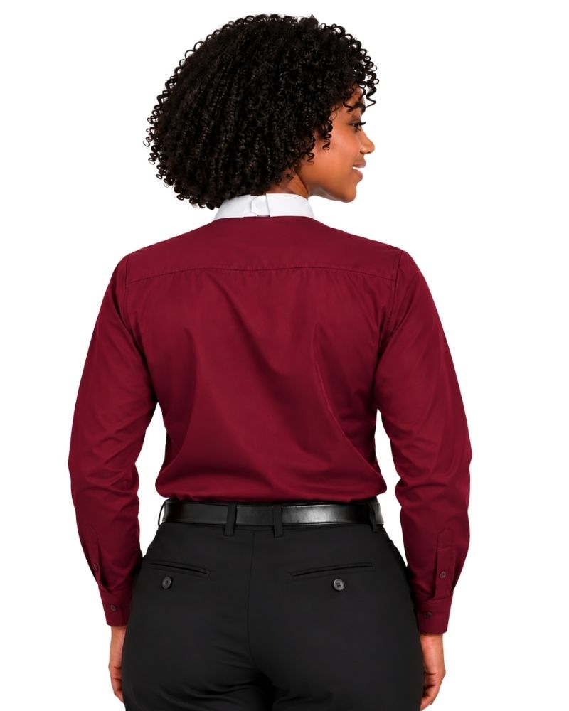 A woman shown from the back wearing a long-sleeve burgundy clerical shirt with a white collar, paired with black trousers and a black belt, against a plain white background.