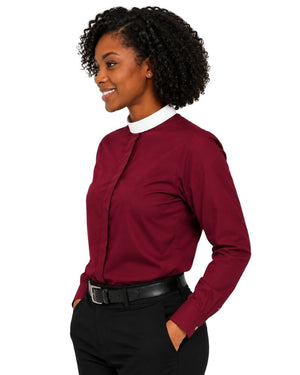 A woman wearing a long-sleeve clerical shirt in burgundy with a contrasting white collar, paired with black trousers and a black belt, shown from a side profile against a white background.